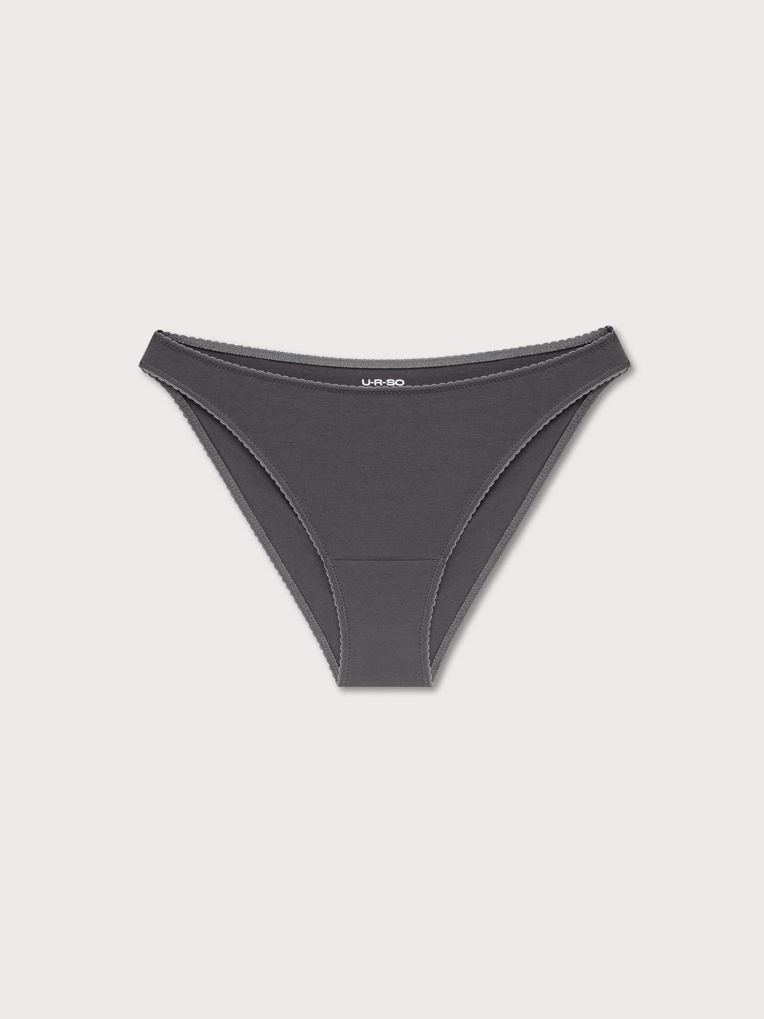 Black bikini undies on a light gray background