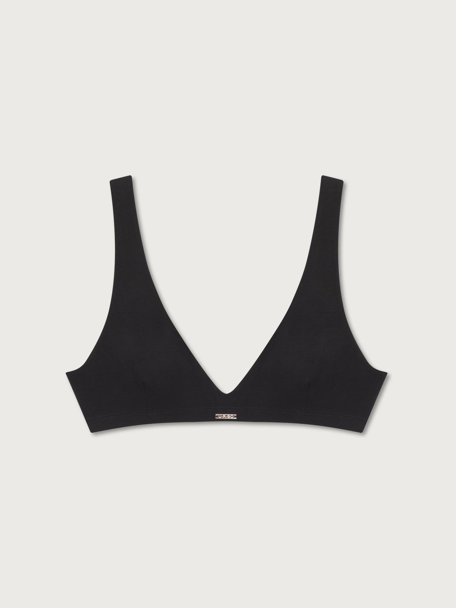 Black bralette on a light gray background