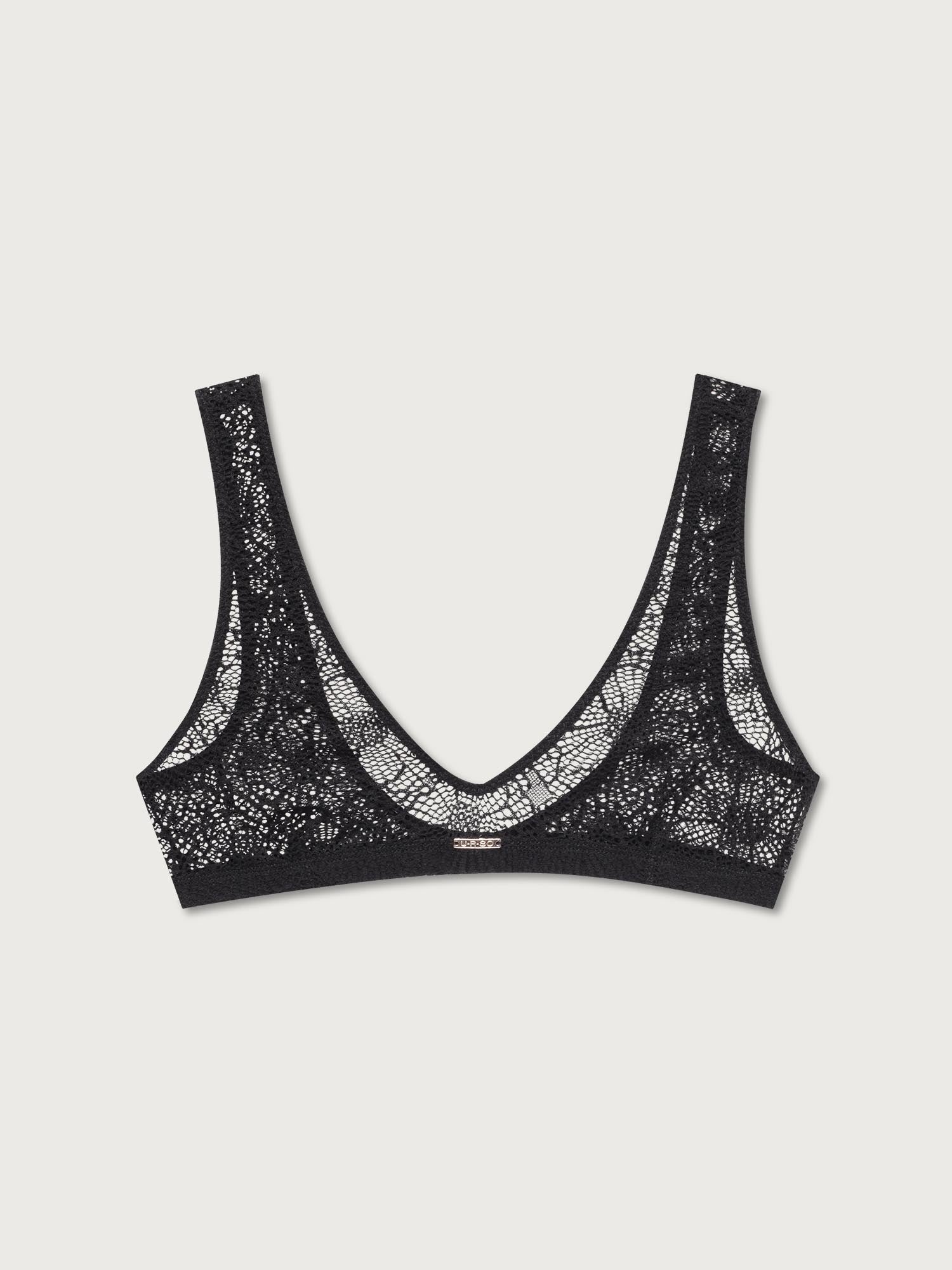 Black lace bralette on a light gray background
