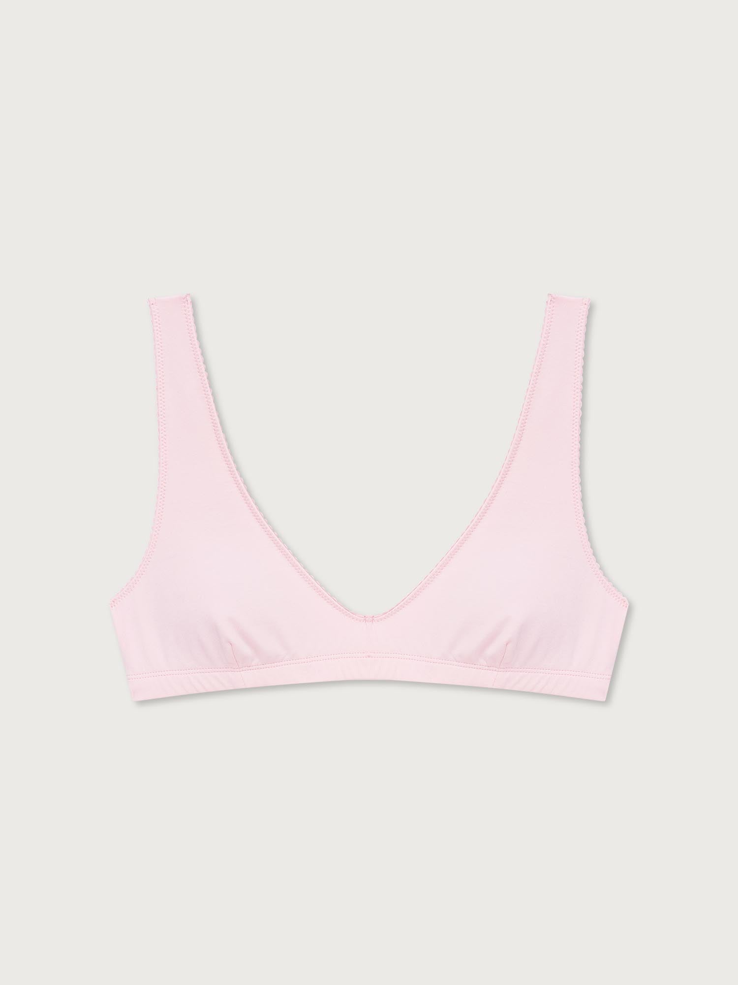 Pink bralette on a light gray background