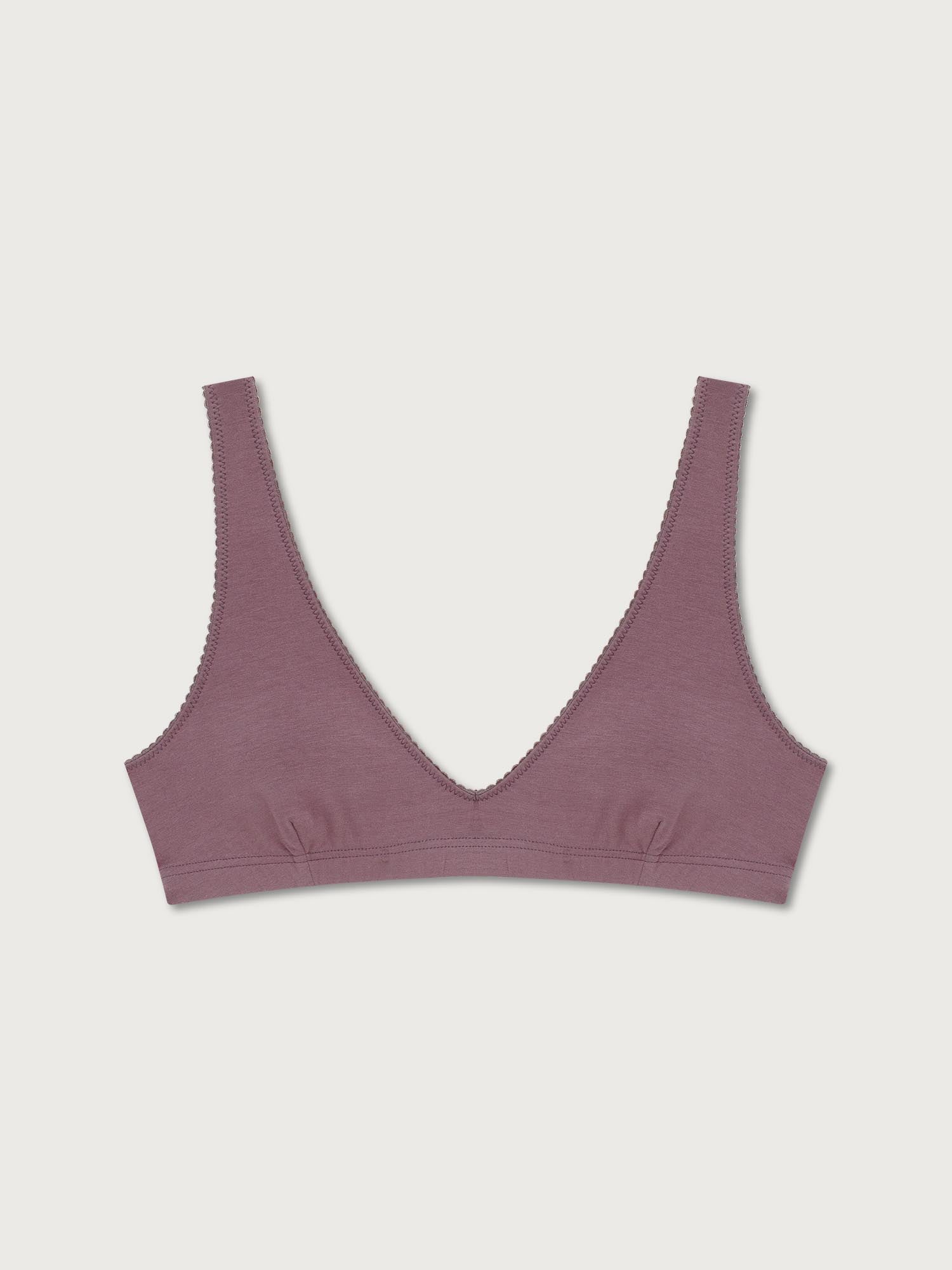 Mauve bralette on a light gray background