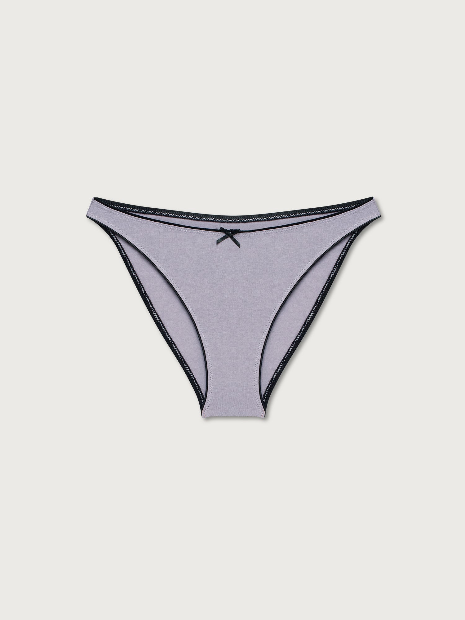 Lilac bikini undies on a light gray background