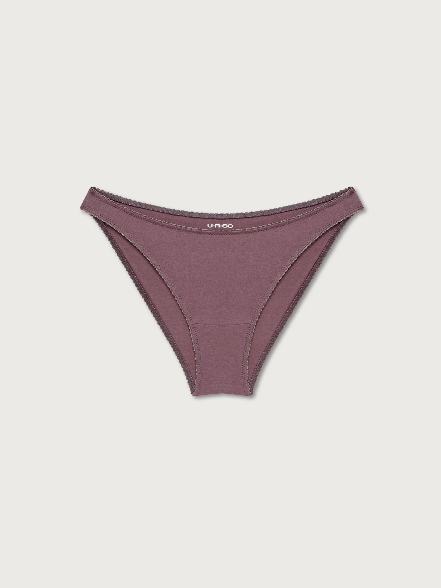 Black bikini undies on a light gray background